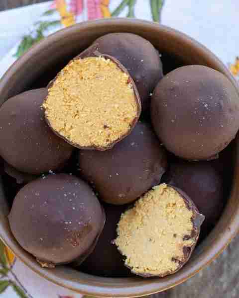 Dark Chocolate Pumpkin truffles are sprinkled with flaky sea salt for a treat that is the perfect ba...