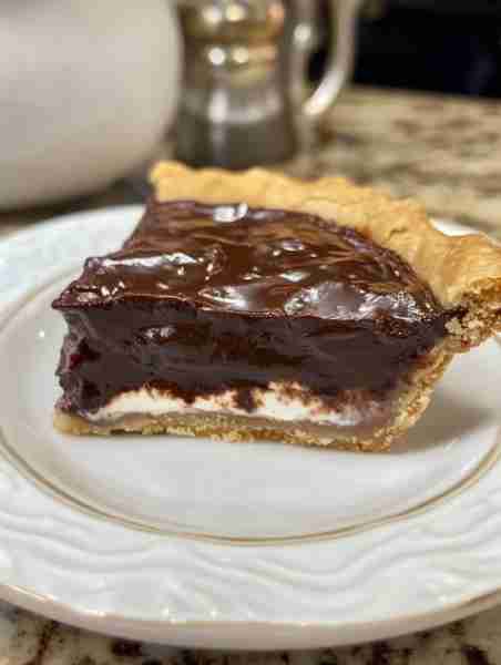 Old Fashioned Chocolate Pie 1-1/4 cup of sugar 1/2 cup of plain flour 1/4 cup of cocoa dash of salt...