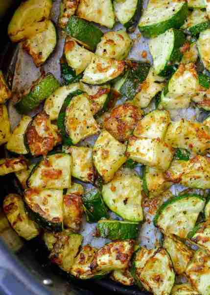 Learn how to make delicious Air Fryer Zucchini with Parmesan! This keto side dish has only four ingr...