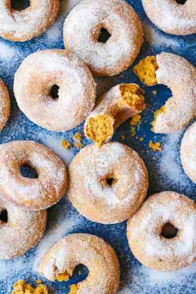 Pumpkin Cake Donuts - The MOST HEAVENLY pumpkin donuts! So moist, they just melt-in-your mouth! Coat...