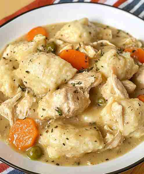 This is the BEST Chicken and Dumplings recipe with easy homemade fluffy dumplings from scratch! Reci...