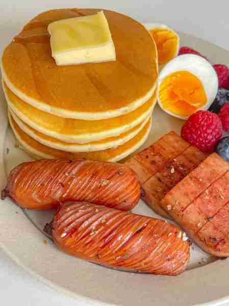 Fluffy pancakes with butter & syrup 🥞🧈, served with grilled sausages 🌭, seared spam 🍖, soft-boil...
