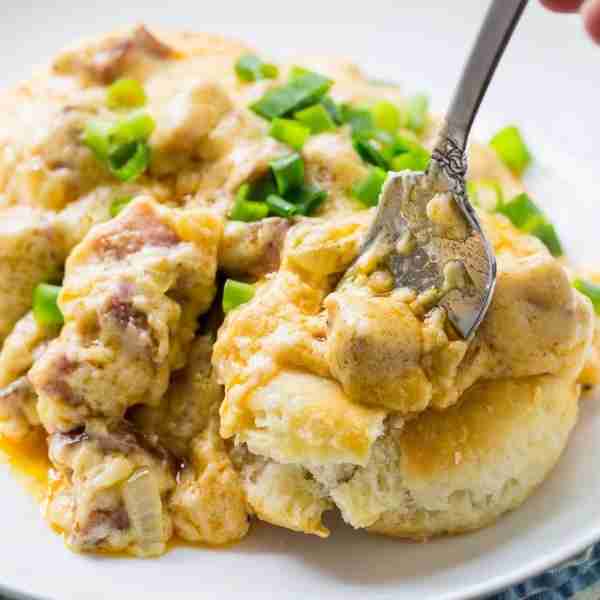 Andouille Sausage Gravy is a spicy, New Orleans-style version of the classic southern breakfast Bisc...