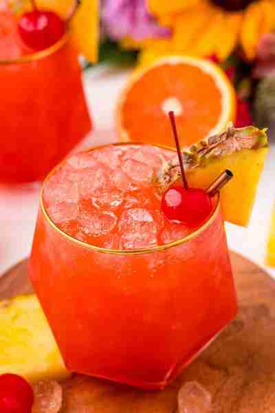 ☀️🌴 Made with a blend of two rums, fresh orange and pineapple juices, and a splash of grenadine - t...