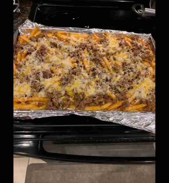 2 pound bag of Walmart brand seasoned fries 1 pound of hamburger meat seasoned with taco seasoning a...