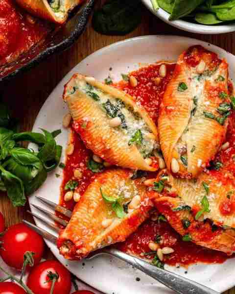 Spinach & Ricotta Stuffed Pasta Shells with Mozzarella, Parmesan, Toasted Pine Nuts, and Marinara Sa...