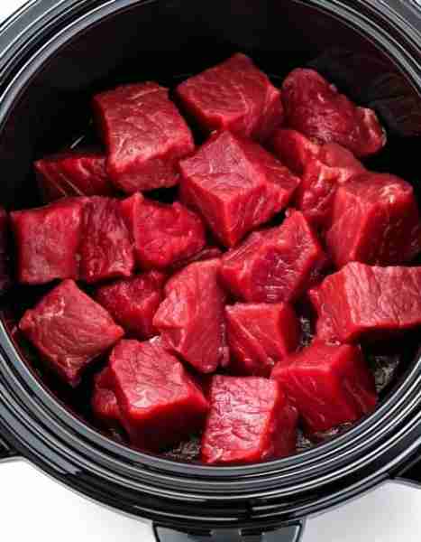 Put raw cubed beef in a slow cooker with these 3 ingredients. You won’t believe how good it tastes.....