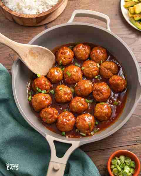 These Tender Oven Baked Buffalo Chicken Meatballs are served in delicious spicy but sweet, tangy Sau...