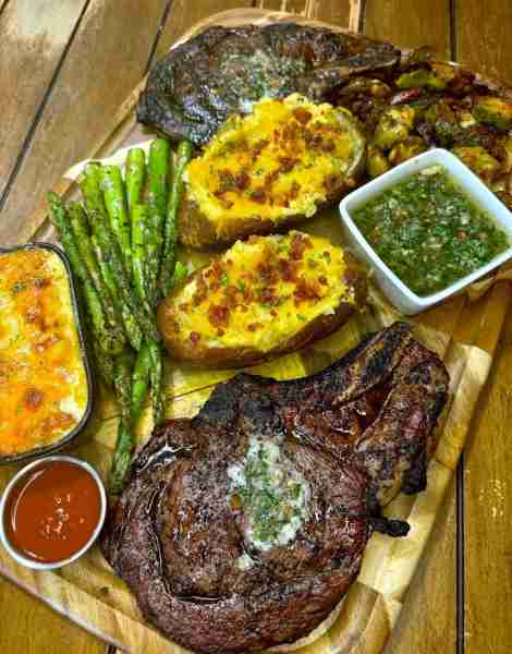 Dinner for 2: 2 smoked ribeyes Honey balsamic glazed Brussels sprouts Loaded baked potatoes Asparagu...