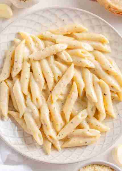 Creamy penne pasta dish is easy to make with a rich garlic Parmesan cheese sauce and Italian seasoni...