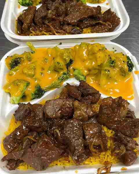 Succulent steak over yellow rice with cheesy broccoli is lunch goals! Dark brown, bright yellow, and...