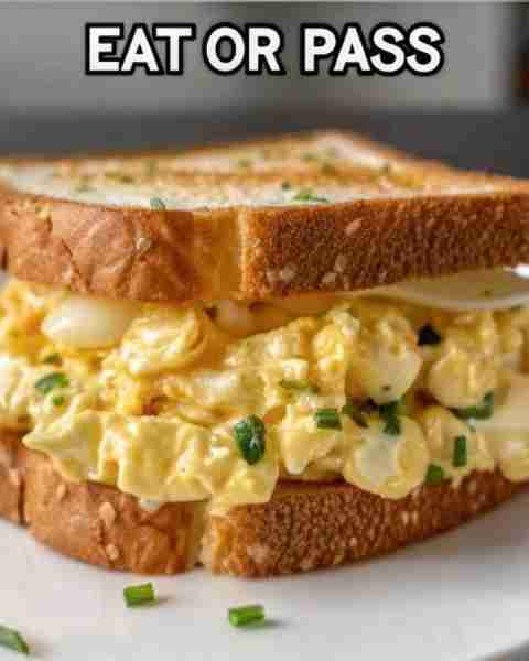 Creamy Egg Salad Sandwich Boil eggs until firm, then peel and chop them. In a bowl, mix the eggs wit...