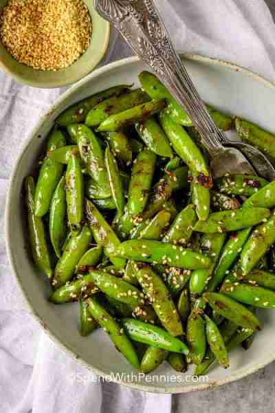 Comment RECIPE to get the recipe! Crisp, garlicky, and delicious, these snap peas are a simple side...