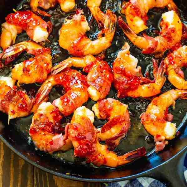 Bacon Wrapped Shrimp with Pepper Jelly Glaze make a wonderful party appetizer. The pepper jelly glaz...