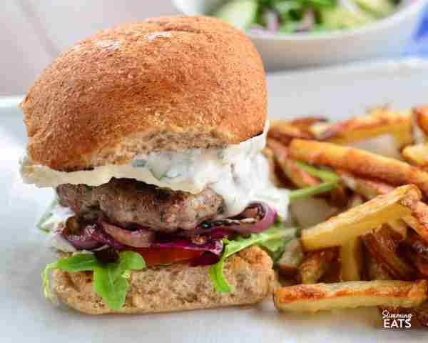 Juicy Greek Style lamb burgers topped with feta and a delicious mint yoghurt ✅ https://www.slimmin...