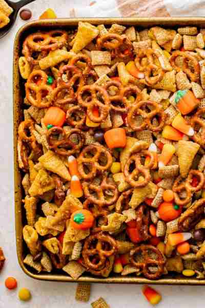 Sweet, salty, and crunchy, this super easy-to-make Halloween Chex mix is the perfect snack mix to ma...