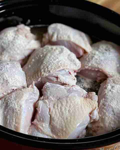Coat chicken in flour and toss in slow cooker. With only 4 more ingredients, get a terrific dinner....