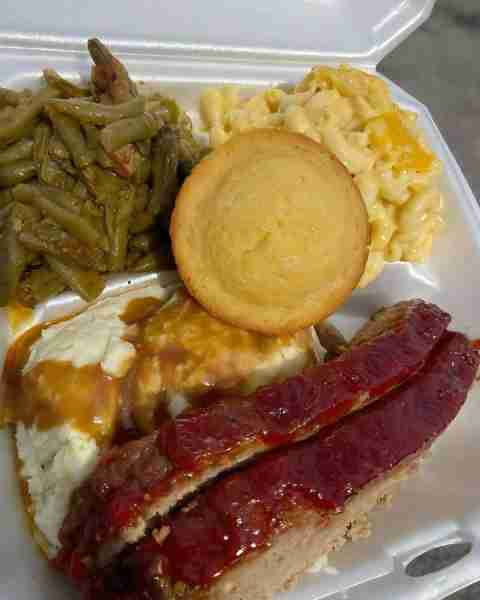 Classic meatloaf dinner with mashed potatoes, mac and cheese, green beans, and cornbread 😋