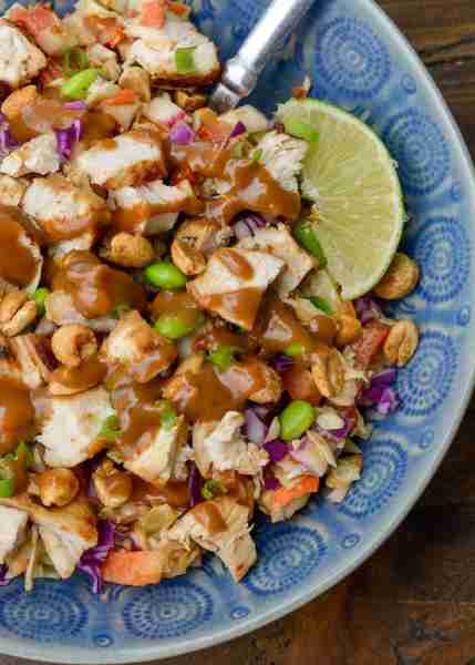 This Crunchy Thai Chicken Salad features fresh cabbage, carrots and bell pepper, all topped with a c...