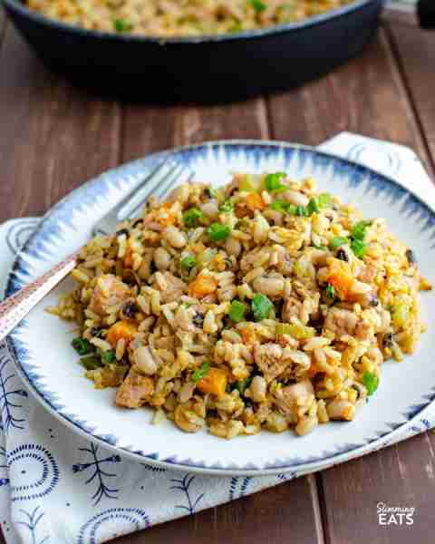 One Pot Southern Hoppin John combines cajun spices with ham, black-eyed peas, and rice - yum!! Recip...