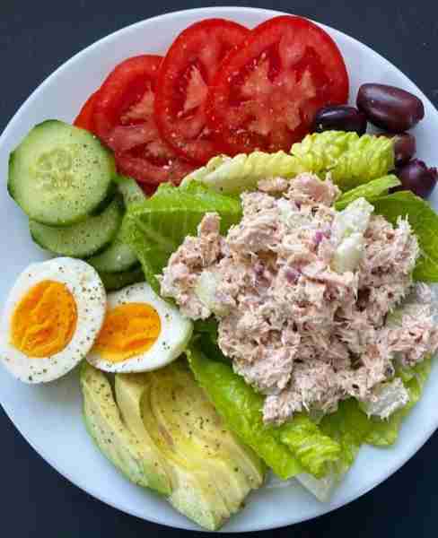Tuna salad made with wild albacore tuna, celery, red onion, black pepper and mayo over romaine lettu...