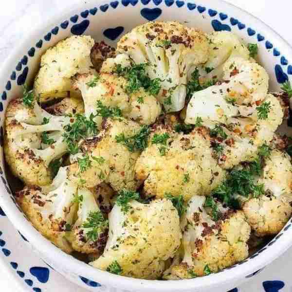 Roasted Cauliflower + Garlic Vinaigrette My FAVORITE veggie side! "Absolutely amazing! So deliciou...