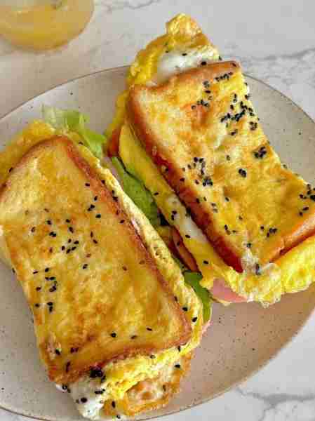 “Egg toast perfection 🥪✨ Crispy edges, fluffy eggs, and melty goodness in every bite! 😍 #Breakfas...