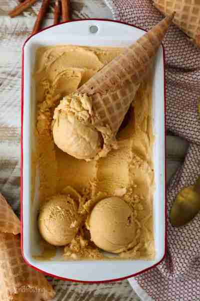 This rich, creamy pumpkin pie ice cream is perfectly scoopable and filled with real pumpkin and spic...