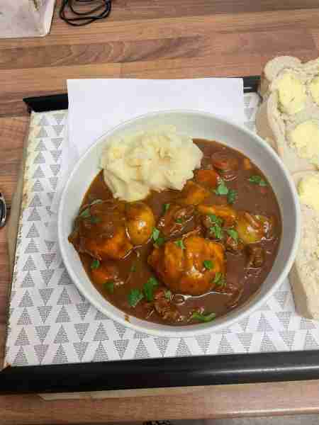 Homemade beef stew and dumplings, with mash and bread & butter by Gemma R