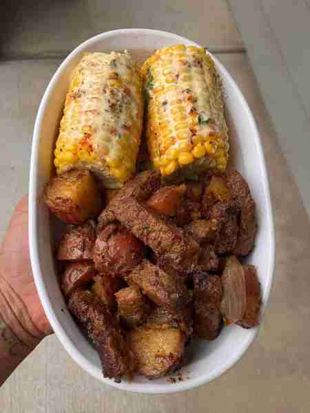 Steak strips & potatoes + corn on the cob🔥