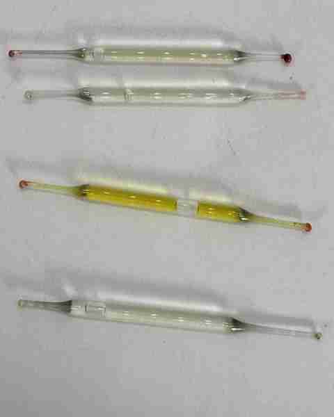 What’s this? Found under a bathroom vanity during remodeling—small glass tubes, 2 inches long, fille...